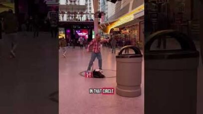 las-vegas-show-girl-scam-hustle-street-performer-demand-tip-from-tourists-buskers-aggressive-scammer.jpg